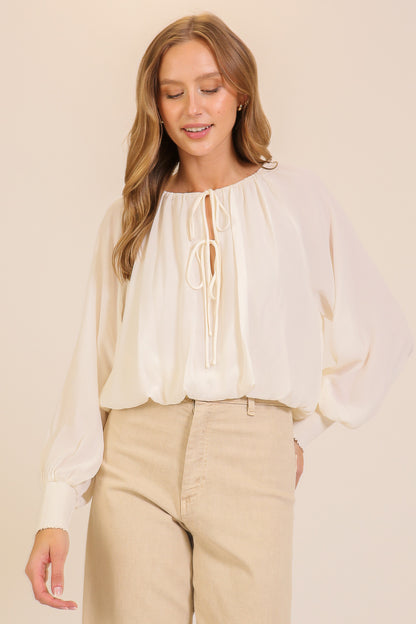 smocked cuff tie neck blouse