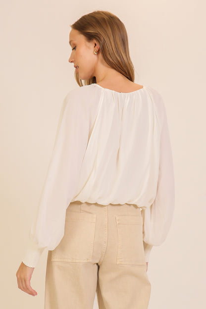 smocked cuff tie neck blouse