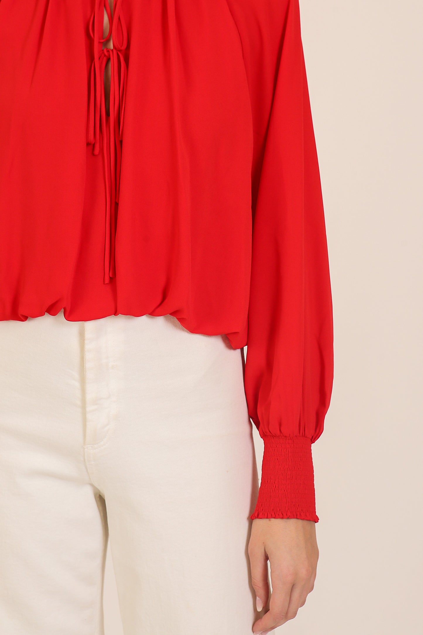 smocked cuff tie neck blouse