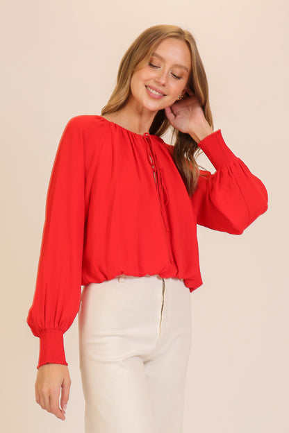 smocked cuff tie neck blouse