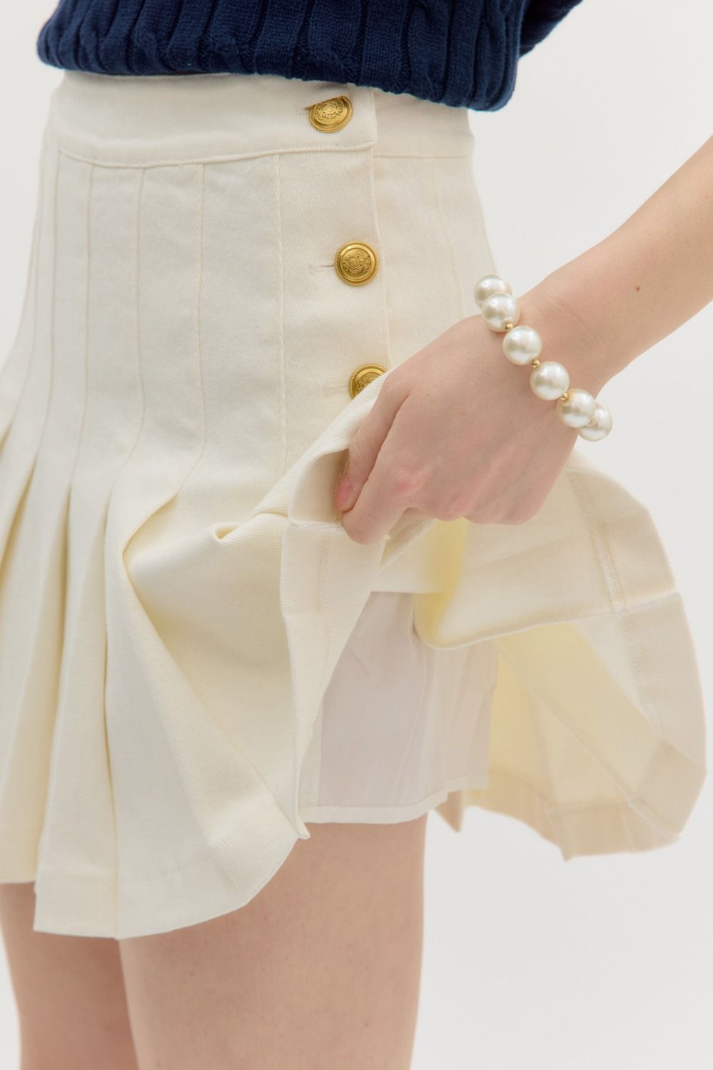 gold button pleated denim skirt